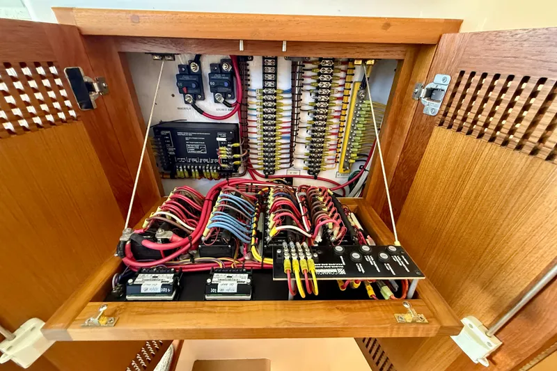 Slide: The Image of Electrical panel of a 2004 Cabo 35 Flybridge boat, showcasing organized wiring and components. - 32