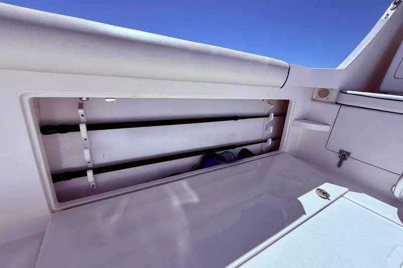 Slide: The Image of Storage compartment on a 2004 Cabo 35 Flybridge boat under clear blue sky. - 54