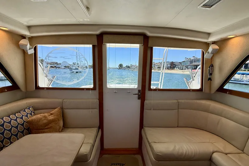 Slide: The Image of Interior view of 2004 Cabo 35 Flybridge yacht with waterfront scenery. - 66