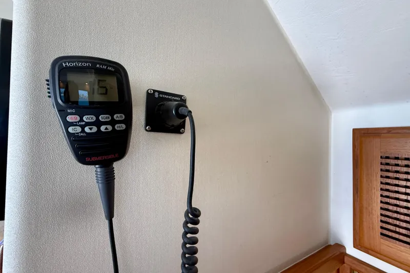 Slide: The Image of VHF radio microphone on 2004 Cabo 35 Flybridge boat interior wall. - 26
