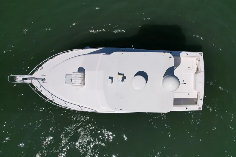 Slide: The Image of Aerial view of 2004 Cabo 35 Flybridge boat on water. - 8