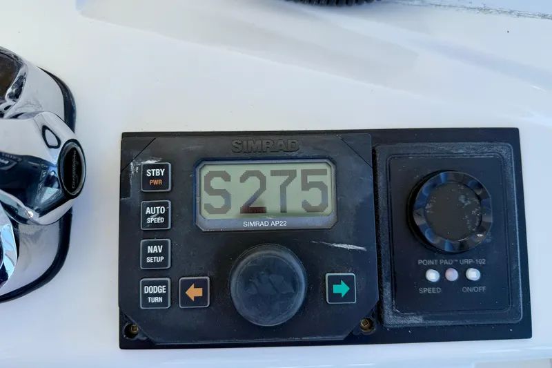 Slide: The Image of Simrad AP22 autopilot display on 2004 Cabo 35 Flybridge boat dashboard. - 37