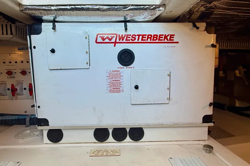 Slide: The Image of Engine compartment of a 2004 Cabo 35 Flybridge with Westerbeke generator. - 69