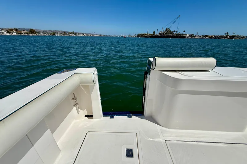 Slide: The Image of 2004 Cabo 35 Flybridge boat deck overlooking calm blue waters. - 51