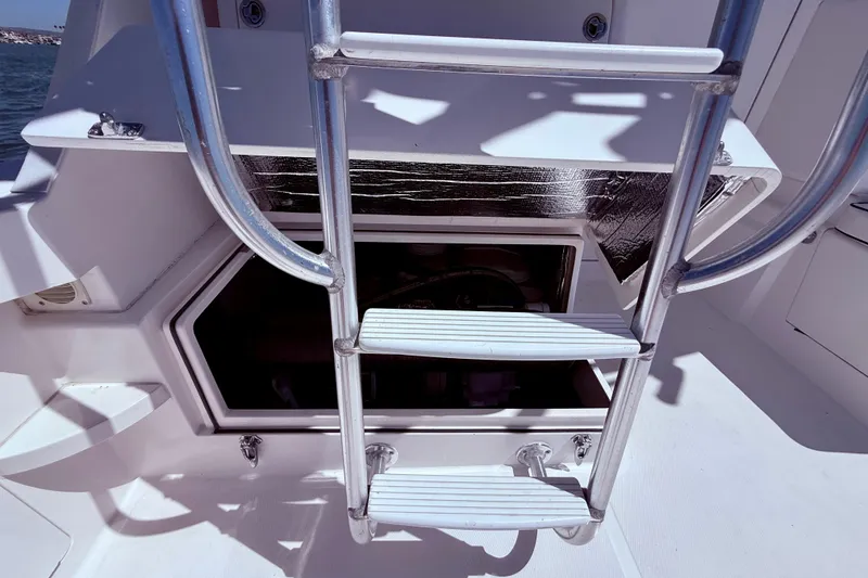 Slide: The Image of Ladder on 2004 Cabo 35 Flybridge yacht, leading to engine compartment. - 62