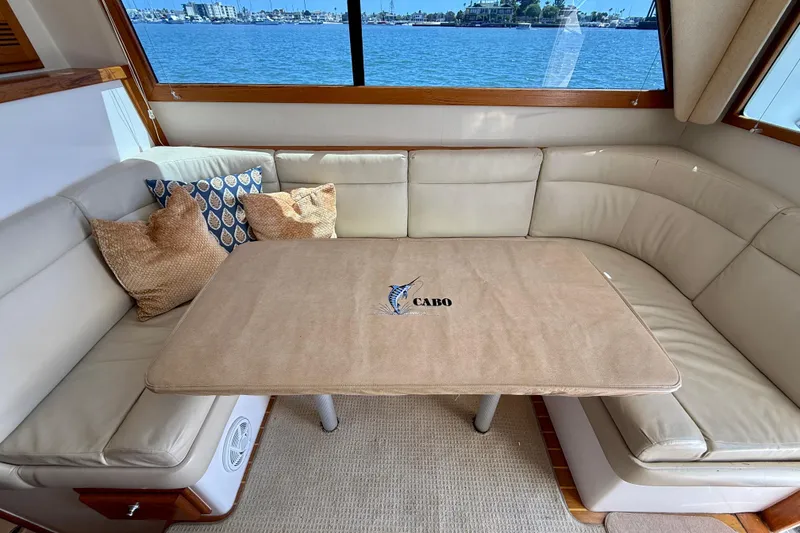 Slide: The Image of Luxurious interior of 2004 Cabo 35 Flybridge yacht with comfortable seating and scenic view. - 63