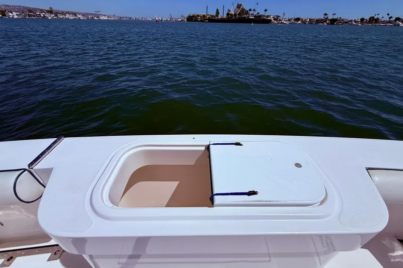 Slide: The Image of Open hatch on 2004 Cabo 35 Flybridge boat, overlooking calm waters. - 52