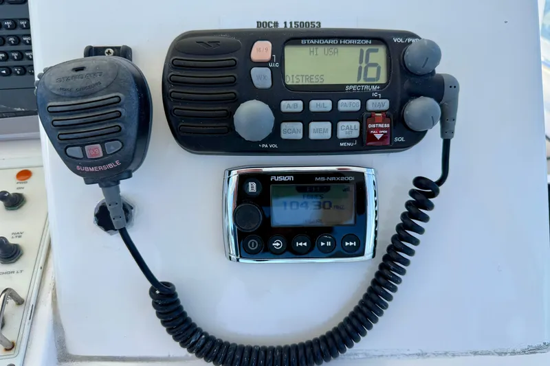 Slide: The Image of Marine radio and control panel on a 2004 Cabo 35 Flybridge boat. - 36