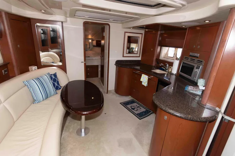Slide: The Image of Luxurious interior of 2007 Sea Ray 44 Sundancer yacht with modern kitchen and seating area. - 13