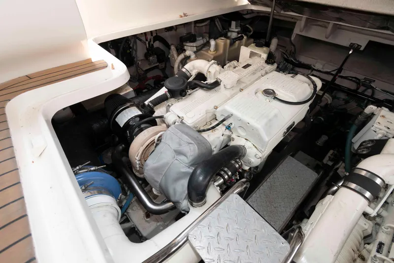Slide: The Image of Engine compartment of a 2007 Sea Ray 44 Sundancer yacht, showcasing mechanical components. - 23