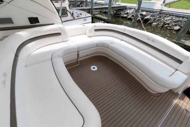 Slide: The Image of Luxurious seating area on 2007 Sea Ray 44 Sundancer yacht, featuring elegant white upholstery. - 6