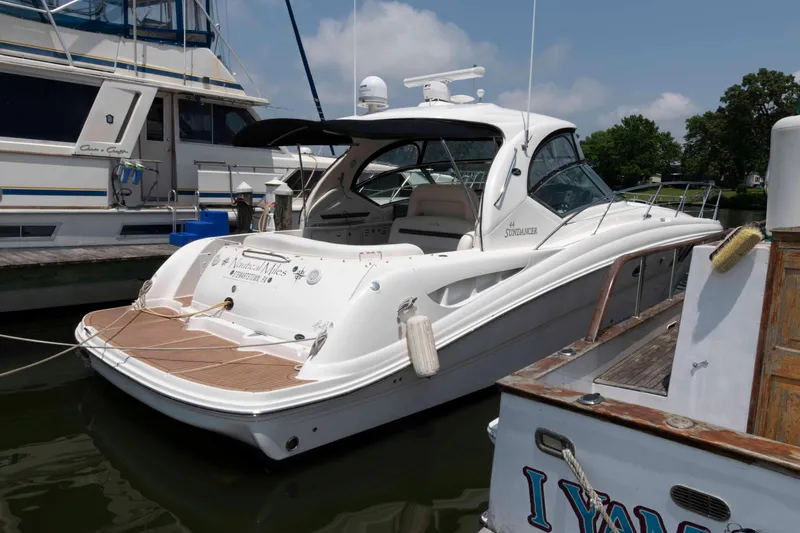 Slide: The Image of 2007 Sea Ray 44 Sundancer yacht docked at marina, rear view. - 2
