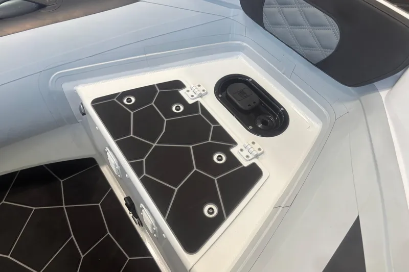 Slide: The Image of 2026 Highfield Sport 360 boat interior with geometric black and white design. - 5