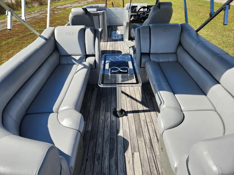 Slide: The Image of The image shows the interior of a 2019 Veranda VTX 25RC boat with gray leather seating. - 7