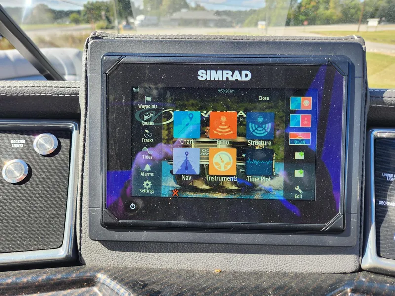 Slide: The Image of Simrad navigation system on a boat with various functions displayed on the screen. - 11