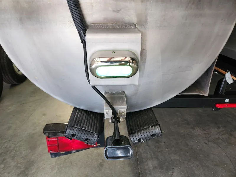 Slide: The Image of Close-up of a boat's stern with lighting and trailer parts. - 17