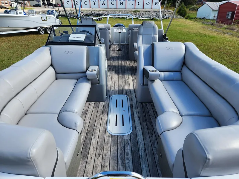 Slide: The Image of Interior view of a Veranda VTX 25RC pontoon boat with gray leather seating and wooden flooring. - 4