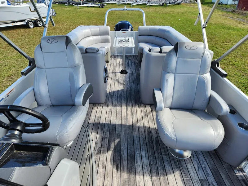 Slide: The Image of The image shows the interior of a 2019 Veranda VTX 25RC boat with gray leather seating. - 5