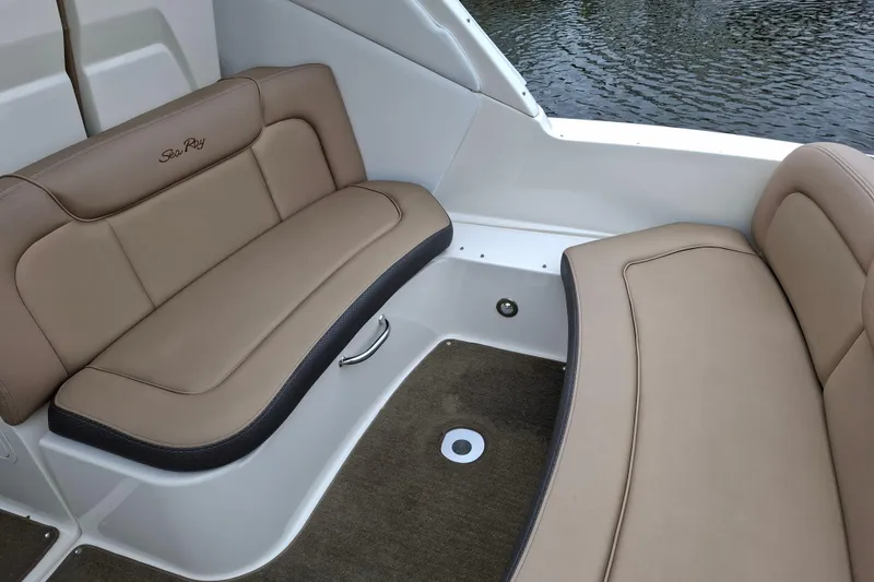 Slide: The Image of 2016 Sea Ray Sundancer 330 interior seating with tan upholstery and water view. - 16