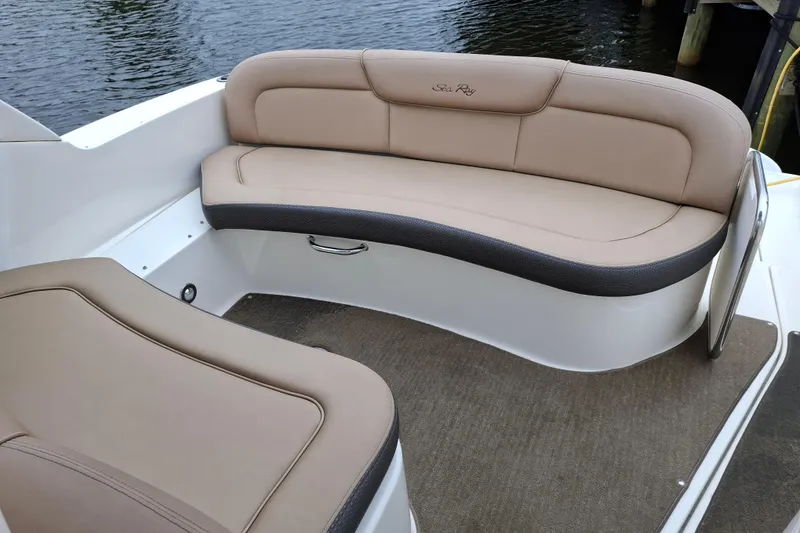 Slide: The Image of Luxurious seating on a 2016 Sea Ray Sundancer 330 boat, featuring beige upholstery. - 11