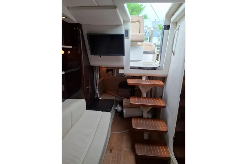 Slide: The Image of Interior of 2016 Sea Ray Sundancer 330 yacht with wooden steps and modern seating. - 13