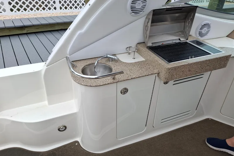 Slide: The Image of Outdoor kitchenette on 2016 Sea Ray Sundancer 330 yacht with sink and grill. - 8
