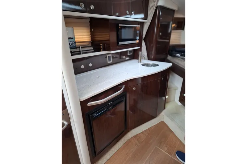 Slide: The Image of Luxurious 2016 Sea Ray Sundancer 330 yacht interior with modern kitchenette. - 21