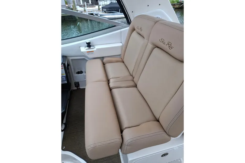 Slide: The Image of Beige leather seating on 2016 Sea Ray Sundancer 330 boat, dockside view. - 9