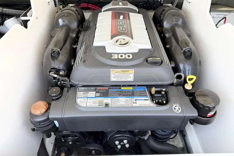 Slide: The Image of 2023 Crownline 240 SS boat engine, featuring a powerful Mercury 6.2L 300 horsepower motor. - 12