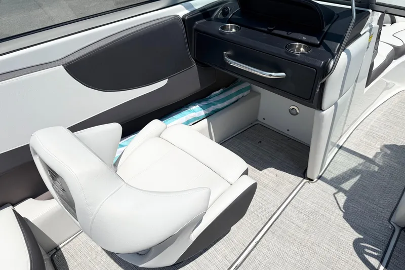 Slide: The Image of 2023 Crownline 240 SS boat interior with white seating and console. - 5