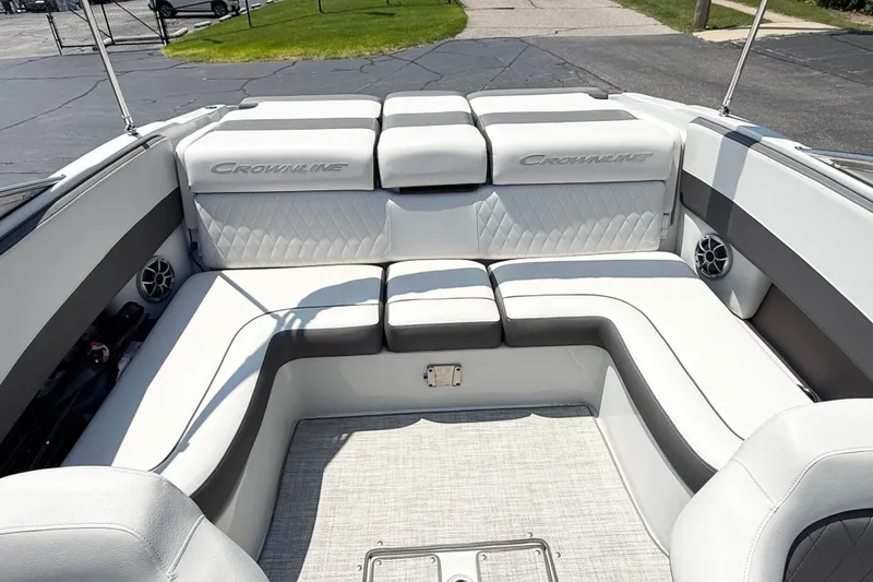Slide: The Image of 2023 Crownline 240 SS boat interior with luxurious white seating and modern design. - 9