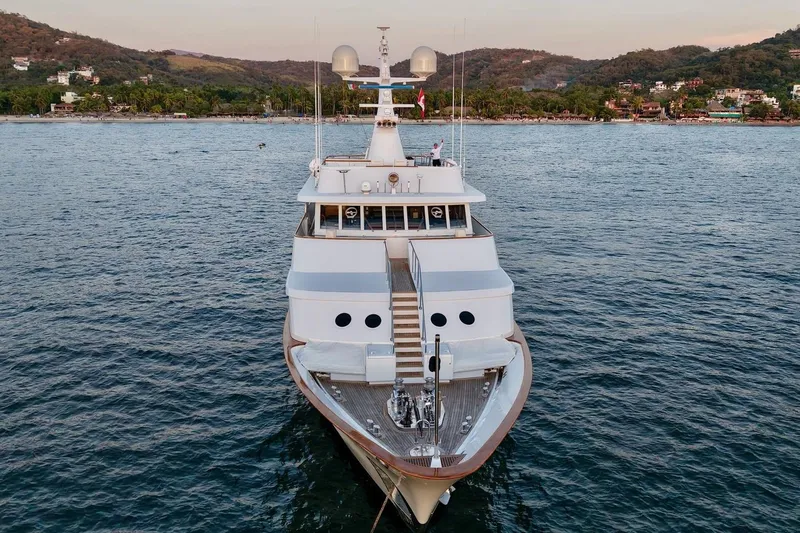 Slide: The Image of Luxury yacht Sterling 137, 1988 model, anchored in scenic coastal waters. - 31