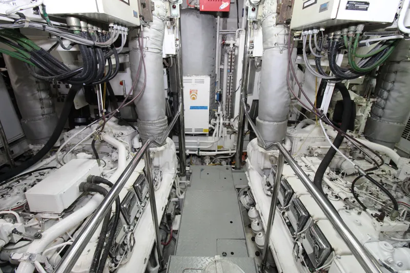 Slide: The Image of Engine room of a 1988 Sterling 137 yacht, showcasing complex machinery and wiring. - 30
