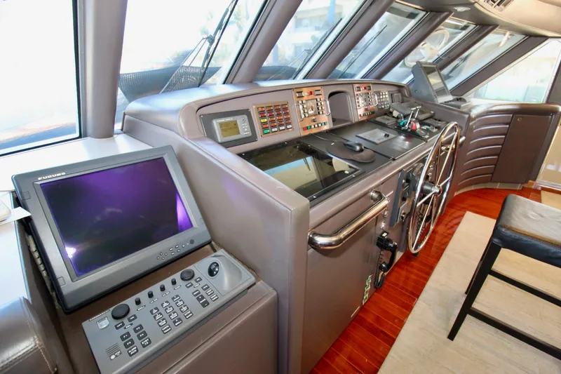 Slide: The Image of 1988 Sterling 137 yacht helm with advanced navigation equipment and control panels. - 27