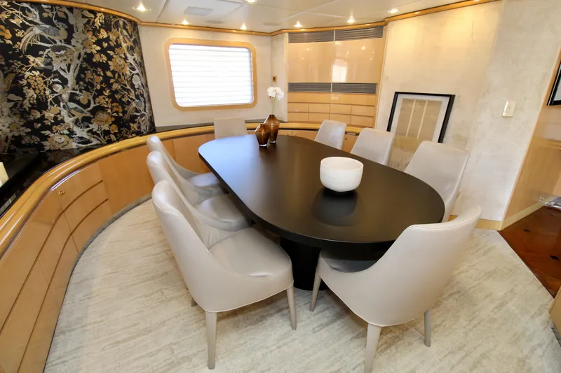 Slide: The Image of Luxurious dining area on a 1988 Sterling 137 yacht with elegant decor and seating. - 7