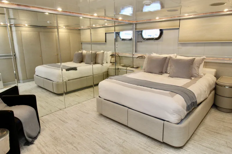 Slide: The Image of Luxurious bedroom interior on 1988 Sterling 137 yacht with mirrored walls and elegant decor. - 10