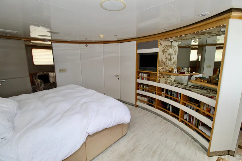 Slide: The Image of Luxurious bedroom interior on a 1988 Sterling 137 yacht, featuring a cozy bed and elegant decor. - 8