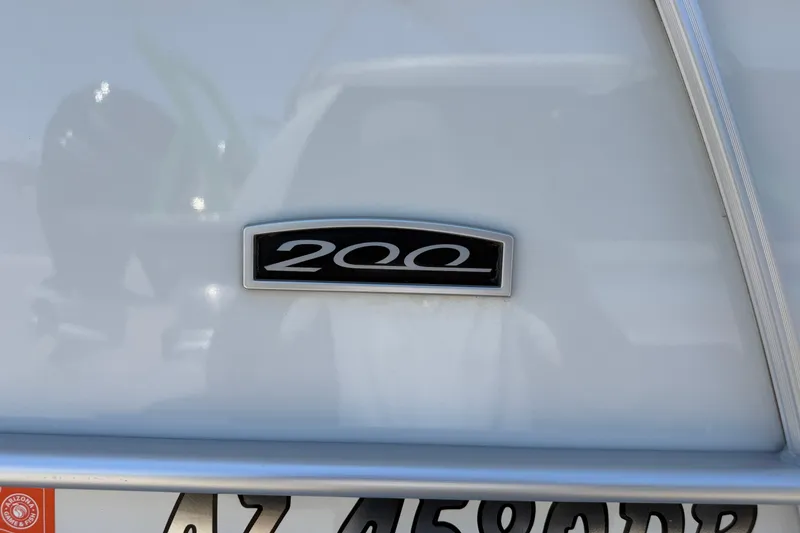 Slide: The Image of Close-up of a 2022 South Bay 224CR2 boat emblem and Arizona license plate. - 17