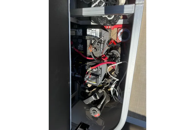 Slide: The Image of Electrical components and wiring inside a 2022 South Bay 224CR2 boat. - 16
