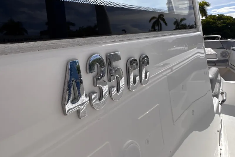 Slide: The Image of Close-up of 2016 Everglades 435 Center Console boat emblem in sunlight. - 17