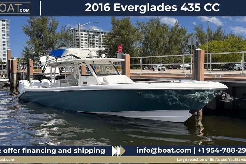 The Image of 2016 Everglades 435 Center Console boat docked at marina, sunny day. - 1
