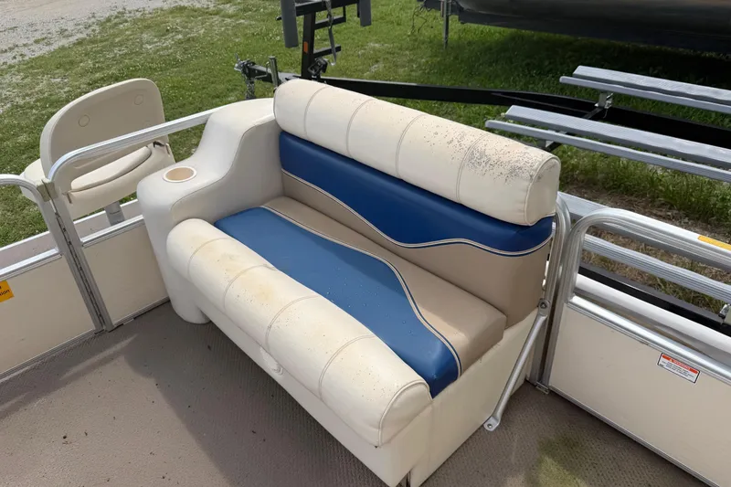 Slide: The Image of 2004 Sweetwater Challenger 200 RE-4 Gate boat seat with blue and beige upholstery. - 8