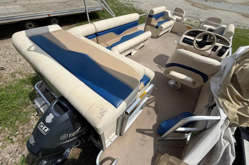Slide: The Image of 2004 Sweetwater Challenger 200 RE-4 Gate pontoon boat interior with Yamaha motor. - 16