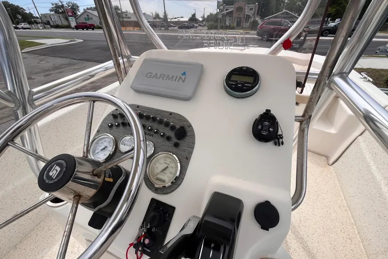 Slide: The Image of 2018 Carolina Skiff 198 DLV boat console with Garmin navigation system and steering wheel. - 9