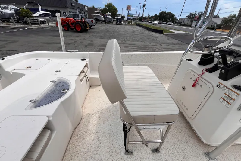 Slide: The Image of 2018 Carolina Skiff 198 DLV boat interior with seating and steering console. - 7