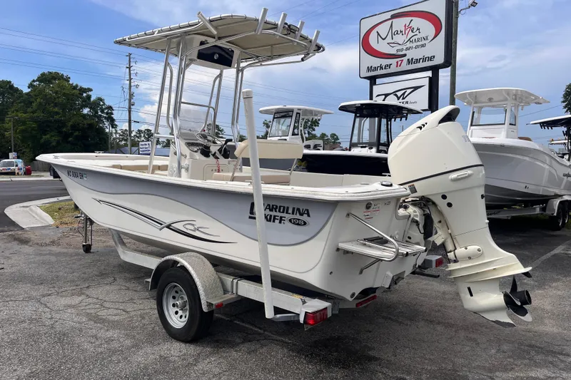 Slide: The Image of 2018 Carolina Skiff 198 DLV boat on trailer at Marker 17 Marine dealership. - 3