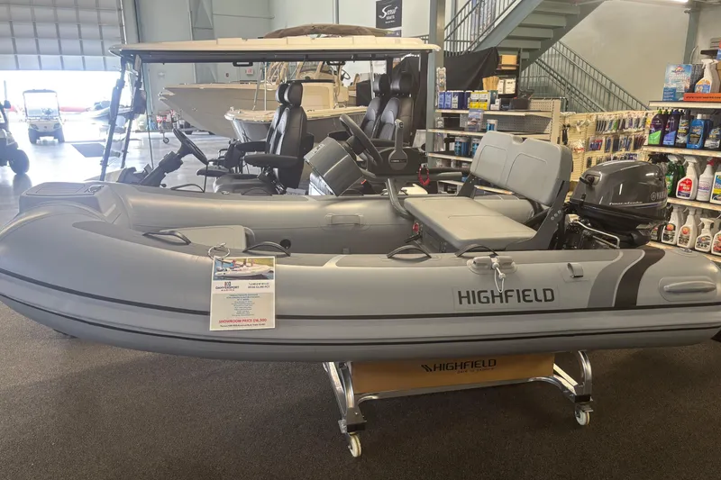 The Image of 2026 Highfield Classic 310 FCT inflatable boat displayed in a showroom. - 1