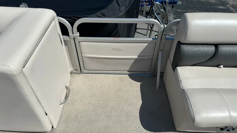 Slide: The Image of Interior of a 2008 Manitou Legacy with beige upholstery and carpeted floor. - 17