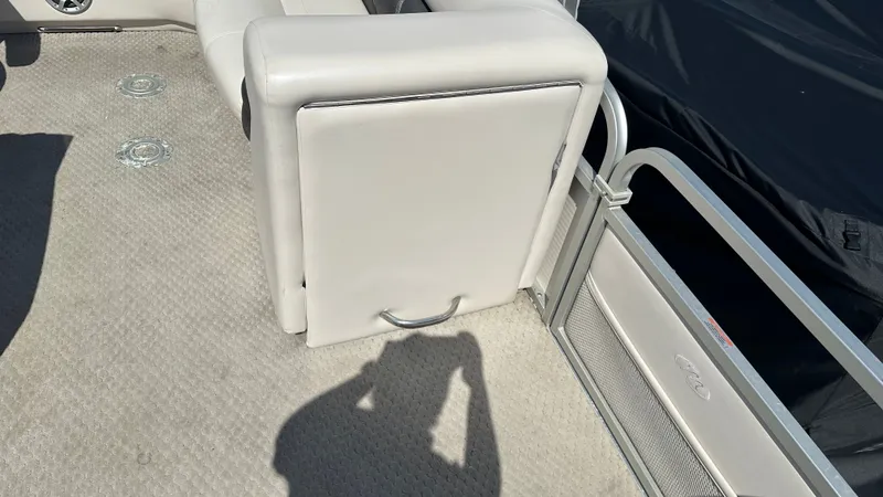 Slide: The Image of Part of a 2008 Manitou Legacy interior with light gray upholstery and carpeted flooring. - 18