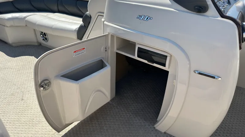 Slide: The Image of The image shows the interior of a 2008 Manitou Legacy with an open storage compartment. - 15